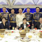 
              In this photo provided by the North Korean government, North Korean leader Kim Jong Un, front right, with his wife Ri Sol Ju, front left, and his daughter poses with military top officials for a photo at a feast to mark the 75th founding anniversary of the Korean People’s Army at an unspecified place in North Korea Tuesday, Feb. 7, 2023. Independent journalists were not given access to cover the event depicted in this image distributed by the North Korean government. The content of this image is as provided and cannot be independently verified. Korean language watermark on image as provided by source reads: "KCNA" which is the abbreviation for Korean Central News Agency. (Korean Central News Agency/Korea News Service via AP)
            