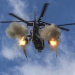
              In this handout photo taken from video and released by the Russian Defense Ministry Press Service on Friday, Oct. 28, 2022, a Ka-52 helicopter gunship of the Russian air force fires rockets at a target at an unknown location in Ukraine. (Russian Defense Ministry Press Service via AP, File)
            