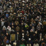 
              Shiite worshippers gather at the golden-domed shrine of Imam Moussa al-Kadhim, who died at the end of the eighth century, during the annual commemoration of the saint's death, in Baghdad, Iraq, Wednesday, Feb. 15, 2023. (AP Photo/Hadi Mizban)
            