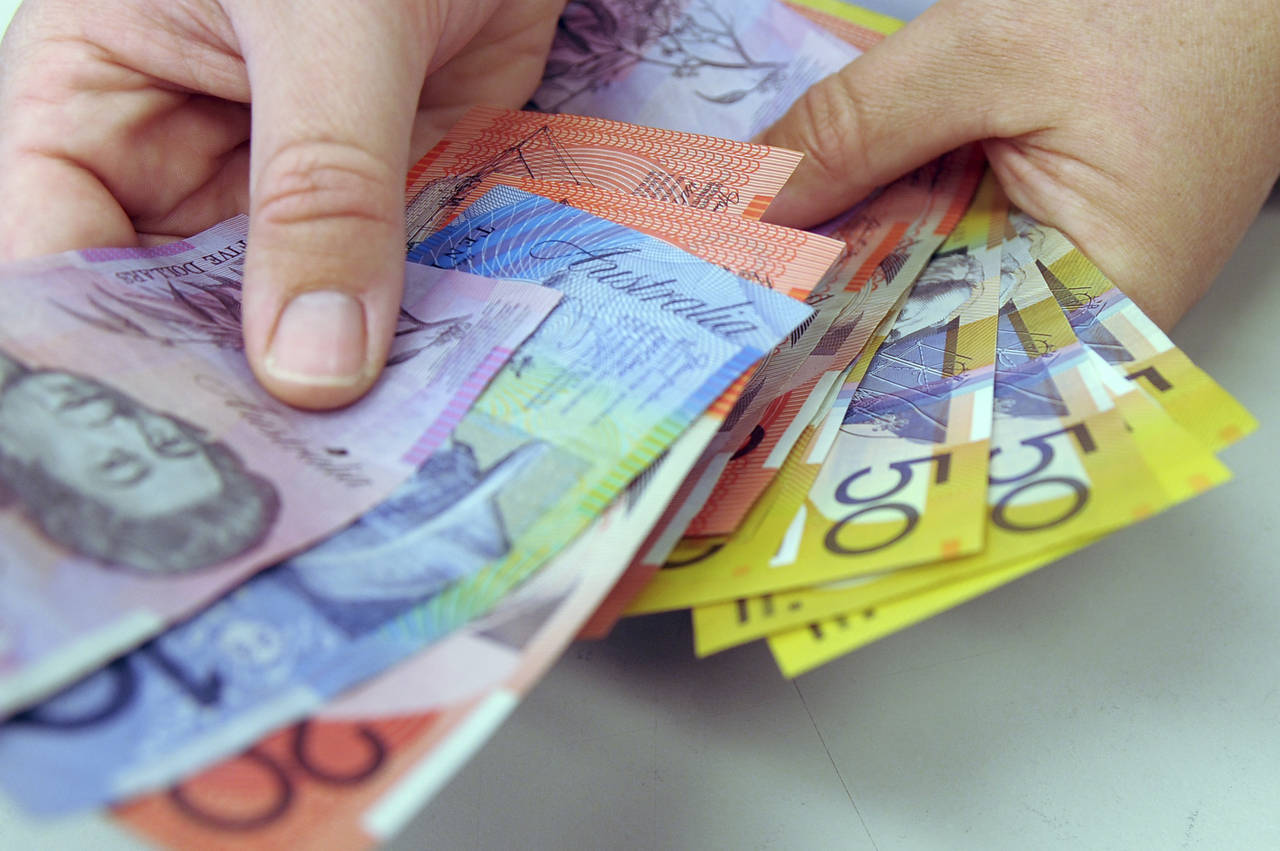 Australian banknotes are being counted in Canberra, Australia, May 1, 2009. Australia is removing t...