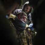 
              Ukrainian military doctors treat an injured comrade at a hospital in the Donetsk region, Ukraine, Monday, Jan. 9, 2023. (AP Photo/Evgeniy Maloletka)
            