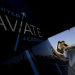 
              United Aviate Academy student pilot Ashley Montano inspects her aircraft prior to a flight, Friday, Oct. 28, 2022, in Goodyear, Ariz. Montano hopes that in a few years she will be flying airline jets. If she does, she'll be helping solve a critical problem facing the industry: not enough pilots. (AP Photo/Matt York)
            