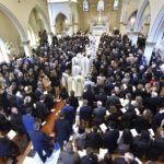 
              The casket of Brian Fraser proceeds into the church as family members, friends, and supporters gather at the funeral mass for Fraser at St Paul on the Lake Catholic Church, in Grosse Pointe Farms, Mich., Saturday, Feb.  18, 2023. Fraser was identified as one of three students slain during a mass shooting on Michigan State University's campus, Monday evening. (Todd McInturf/Detroit News via AP, Pool)
            