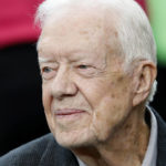 
              CORRECTS DATE OF CARTER CENTER'S STATEMENT TO FEB. 18, NOT FEB. 19 - FILE - Former President Jimmy Carter sits on the Atlanta Falcons bench before the first half of an NFL football game between the Falcons and the San Diego Chargers, Sunday, Oct. 23, 2016, in Atlanta. Carter, at age 98 the longest-lived American president, has had a recent series of short hospital stays. The Carter Center said in a statement Saturday, Feb. 18, 2023, that the 39th president has now “decided to spend his remaining time at home with his family and receive hospice care instead of additional medical intervention.” (AP Photo/John Bazemore, File)
            