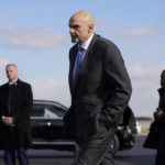 
              FILE - Sen. John Fetterman, D-Pa., walks to a motorcade vehicle after stepping off Air Force One behind President Joe Biden, Feb. 3, 2023, at Philadelphia International Airport in Philadelphia. On Thursday, Feb. 16, Fetterman's office announced that the senator had checked himself into the hospital for clinical depression.(AP Photo/Patrick Semansky, File)
            