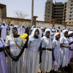 
              Faithful and nuns wait for the arrival of Pope Francis in Juba, South Sudan, Friday, Feb. 3, 2023. After meeting with members of the Congolese Bishops Conference in Kinshasa, Democratic Republic of Congo, Pope Francis is traveling to South Sudan on the second leg of a six-day trip that started in Congo, hoping to bring comfort and encouragement to two countries that have been riven by poverty, conflicts and what he calls a "colonialist mentality" that has exploited Africa for centuries. (AP Photo/Ben Curtis)
            