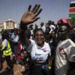 
              People in the crowd cheer and wave as Pope Francis is wheeled past after addressing clergy at the St. Theresa Cathedral in Juba, South Sudan, Saturday, Feb. 4, 2023. Pope Francis is in South Sudan on the second leg of a six-day trip that started in Congo, hoping to bring comfort and encouragement to two countries that have been riven by poverty, conflicts and what he calls a "colonialist mentality" that has exploited Africa for centuries. (AP Photo/Ben Curtis)
            