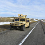 
              A U.S. Air Force security vehicle is seen on a central Montana highway, Tuesday, Feb 7, 2023, near Harlowton, Mont. Lawmakers in at least 11 statehouses and Congress are weighing further restrictions on foreign ownership of U.S. farmland following the balloon's journey over an area with dozens of nuclear missile silos. (AP Photo/Matthew Brown)
            