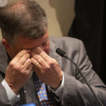 
              Chris Wilson, a trial attorney, tears up while questioned by prosecutor Creighton Waters during Alex Murdaugh's double murder trial, Thursday, Feb. 2, 2023, in Walterboro, S.C. The 54-year-old attorney is standing trial on two counts of murder in the shootings of his wife and son at their Colleton County home and hunting lodge on June 7, 2021. (Andrew J. Whitaker/The Post And Courier via AP)
            