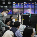 
              Currency traders work at the foreign exchange dealing room of the KEB Hana Bank headquarters in Seoul, South Korea, Friday, Feb. 24, 2023. Shares in Asia were mixed Friday after Wall Street broke its longest losing streak since December with a modest rally led by tech stocks. (AP Photo/Ahn Young-joon)
            