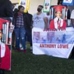 
              Family members and relatives of Anthony Lowe hold signs during a news conference in Huntington Park, Calif., Monday, Feb. 6, 2023. Authorities are investigating the fatal shooting by police of a stabbing suspect who officers said threatened them with a large knife near Los Angeles last week. (AP Photo/Jae C. Hong)
            