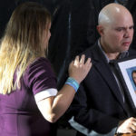 
              FILE - Lori Alhadeff, and her husband, Ilan Alhadeff, holding a photo of their daughter Alyssa, speak to the media after the sentencing hearing for Marjory Stoneman Douglas High School shooter Nikolas Cruz at the Broward County Courthouse in Fort Lauderdale, Fla., on Wednesday, Nov. 2, 2022. Alyssa was killed in the 2018 shooting. (Mike Stocker/South Florida Sun-Sentinel via AP, File)
            