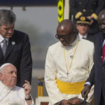 
              Pope Francis talks with South Sudan's President Salva Kiir, right, upon his arrival at Juba's airport, South Sudan, Friday, Feb. 3, 2023. Francis is in South Sudan on the second leg of a six-day trip that started in Congo, hoping to bring comfort and encouragement to two countries that have been riven by poverty, conflicts and what he calls a "colonialist mentality" that has exploited Africa for centuries. (AP Photo/Gregorio Borgia)
            