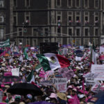 
              Anti-government demonstrators march against recent reforms pushed by President Andres Manuel Lopez Obrados to the country's electoral law that they say threaten democracy, in Mexico City's main square, The Zocalo, Sunday, Feb. 26, 2023. (AP Photo/Fernando Llano)
            