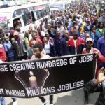 
              Small and medium business traders and other demonstrators carry banners as they protest asking the government to chase Chinese traders away, in Nairobi, Kenya, Tuesday, Feb. 28, 2023. The traders carried banners with Anti-Chinese messages and chanted 'Chinese must go', claiming Chinese businesspeople have flooded the city with counterfeit and cheap products, killing Kenyan businesses. (AP Photo)
            