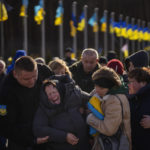 
              Valentyna Samoilenko reacts next to the body of her son Dmytro, 34, during his funeral in Irpin, near Kyiv, Ukraine, Tuesday, Feb. 14, 2023. Dmytro Samoilenko, a civilian who was a volunteer in the armed forces of Ukraine, was killed in the fighting in Bakhmut area. (AP Photo/Emilio Morenatti)
            