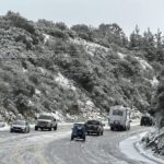 
              In this photo provided by the Santa Barbara County Fire Department, vehicles drive in the snow near the 2,200 ft summit of San Marcos Pass along Highway 154 in Santa Barbara County, Calif., Thursday, Feb. 23, 2023. (Mike Eliason/Santa Barbara County Fire Department via AP)
            
