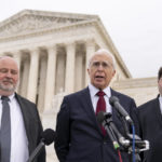 
              Attorney Eric Schnapper, center, accompanied by attorney Keith Altman, left, and attorney Robert Tolchin, right, speaks to members of the media, Wednesday, Feb. 22, 2023, in Washington, after the Supreme Court heard oral arguments.  The Supreme Court is weighing Wednesday whether Facebook, Twitter and YouTube can be sued over a 2017 Islamic State group attack on a Turkish nightclub based on the argument the platforms assisted in fueling the growth of the terrorist organization.  (AP Photo/Andrew Harnik)
            