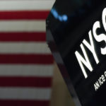 
              FILE - An NYSE sign is seen on the floor at the New York Stock Exchange in New York, Wednesday, June 15, 2022. (AP Photo/Seth Wenig, File)
            