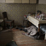 
              The body of an elderly woman lies inside a house in Bucha, outskirts of Kyiv, Ukraine, Tuesday, April 5, 2022. (AP Photo/Felipe Dana)
            