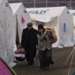
              People with their belongings arrive at the tents, in Kharamanmaras, southeastern Turkey, Friday, Feb. 10, 2023. Rescuers pulled several people alive from the shattered remnants of buildings on Friday, some who survived more than 100 hours trapped under crushed concrete in the bitter cold after a catastrophic earthquake slammed Turkey and Syria. (AP Photo/Kamran Jebreili)
            