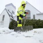 
              Worker Bayron Barrientos, of Providence, R.I., shovels snow off a path, Tuesday, Feb. 28, 2023, in front of a church, in Norwood, Mass. Parts of the Northeast are gearing up for what could be heavy snow Tuesday. (AP Photo/Steven Senne)
            
