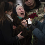 
              FILE - Nina Nikiforovа, 80, cries outside a church in Kyiv, Ukraine, on Feb. 11, 2023, at the funeral of her son Volodymyr, a Ukrainian serviceman who was killed in the eastern part of the country. Some experts warn that the war, which already has killed tens of thousands on both sides and reduced entire cities to ruins, could drag on for years. (AP Photo/Emilio Morenatti, File)
            