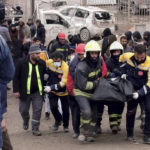 
              Firefighters carry the body of a victim in Diyarbakir, in southeastern Turkey, Monday, Feb. 6, 2023. A powerful earthquake that struck southeast Turkey and northern Syria has killed more than 640 people with hundreds injured. The toll is expected to rise as rescuers search for dead and survivors in dozens of collapsed buildings across the region. (AP Photo/Mahmut Bozarsan)
            