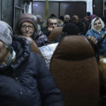 
              FILE - People from Soledar sit inside a bus as they wait to be registered and take up temporary accommodation somewhere near Shakhtarsk, in Russian-controlled Donetsk region, eastern Ukraine, Friday, Jan. 13, 2023. Russia claimed Friday that its forces captured Soledar, but Ukrainian authorities said the fight for Soledar continued. (AP Photo, File)
            