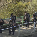 
              In this image taken from video footage provided by TVB Hong Kong, police officers prepare to conduct a search on a hillside following a murder case of a model, in Hong Kong on Sunday, Feb. 26, 2023. Police in Hong Kong have filed murder charges against the former in-laws of a model, days after her body parts were found in a refrigerator. A police statement says Hong Kong model Abby Choi’s father-in-law and his eldest son are being charged with murder, while her mother-in-law faces one count of perverting the course of justice. (TVB Hong Kong via AP)
            