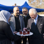 
              King Charles III meets members of the Turkish diaspora community who have been collecting, packaging and organising the transportation of food, blankets and warm clothing for people who have recently been affected by the earthquakes in Turkey, during a visit to the West London Turkish Volunteers in Hounslow, Tuesday Feb. 14, 2023. (Kirsty O'Connor/Pool photo via AP)
            