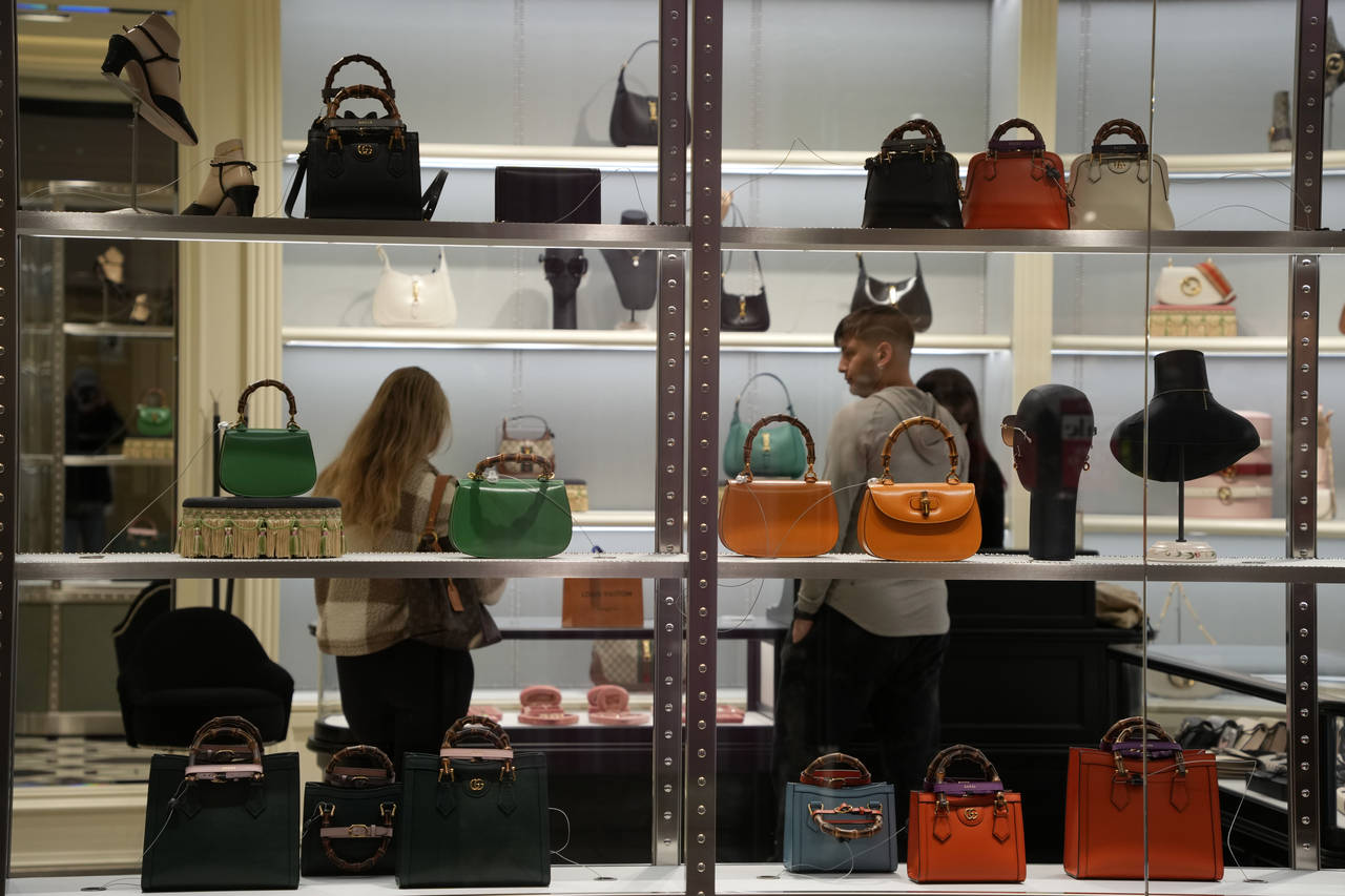 Bags are displayed in the window of a Kate Spade store in Pittsburgh on Monday, Jan. 30, 2023. On T...