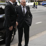 
              Former Australian Prime Minister John Howard, right, arrives for the funeral and interment of polarizing Cardinal George Pell is under way at St. Mary's Cathedral in Sydney, Thursday, Feb. 2, 2023. Pell, who died last month at age 81, spent more than a year in prison before his sex abuse convictions were overturned in 2020. (AP Photo/Rick Rycroft)
            