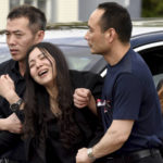 
              FILE - Peter Wang's mother, Hui, cries as she is helped into a waiting car with her family after the memorial service for her 15-year-old son at Kraeer Funeral Home in Coral Springs, Fla., Tuesday, Feb. 20, 2018. Peter Wang is a victim in the shooting at Marjory Stoneman Douglas High School. (Taimy Alvarez/South Florida Sun-Sentinel via AP, File)
            