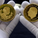 
              Coins featuring the portraits of King Charles III, right, and Queen Elizabeth II, are assessed during the "Trial of the Pyx,'' a ceremony that dates to the 12th Century in which coins are weighed in order to make certain they are up to standard, at the Goldsmiths' Hall in London, Tuesday, Feb. 7, 2023. A jury sat solemnly in a gilded hall in central London on Tuesday, presided over by a bewigged representative of the crown in flowing black robes, but there were no criminals in the dock. (AP Photo/Kin Cheung)
            