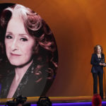 
              Bonnie Raitt accepts the award for song of the year for "Just Like That" at the 65th annual Grammy Awards on Sunday, Feb. 5, 2023, in Los Angeles. First Lady Jill Biden looks on from right. (AP Photo/Chris Pizzello)
            