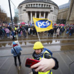 
              A demonstration in support of strikers is seen in central Manchester, England, Wednesday, Feb. 1, 2023. Up to half a million workers are expected to go on strike across the U.K. in what's shaping up to be the biggest day of industrial action Britain has seen in more than a decade. (AP Photo/Jon Super)
            