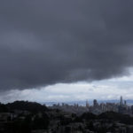 
              Rain clouds hover over San Francisco, Friday, Feb. 24, 2023. California and other parts of the West are facing heavy snow and rain from the latest winter storm to pound the United States. The National Weather Service has issued blizzard warnings for the Sierra Nevada and Southern California mountains. (AP Photo/Jeff Chiu)
            