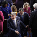 
              Sen. Joe Manchin, D-W.Va., and Sen. Mitt Romney, R-Utah, leave after President Joe Biden delivered the State of the Union address to a joint session of Congress at the U.S. Capitol, Tuesday, Feb. 7, 2023, in Washington. (AP Photo/Patrick Semansky)
            
