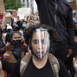 
              FILE - Protesters gather at Foley Square, June 2, 2020, in New York, as part of a demonstration against police brutality sparked by the death of George Floyd, a Black man who died earlier that year after Minneapolis police officers restrained him.  The death of Tyre Nichols in Memphis stands apart from some other police killings because the young Black man was beaten by Black officers. But the fact that Black officers killed a Black man didn’t remove racism from the situation. (AP Photo/Yuki Iwamura, File)
            