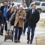 
              Michael J. Allen, front right, district attorney for Colorado's Fourth Judicial District, leads a contingent of lawyers into the El Paso County courthouse for a preliminary hearing for the alleged shooter in the Club Q mass shooting Wednesday, Feb. 22, 2023, in Colorado Springs, Colo. (AP Photo/David Zalubowski)
            