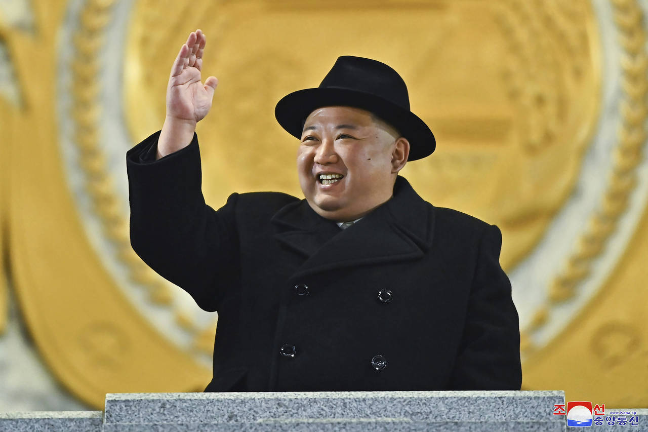 In this photo provided by the North Korean government, North Korean leader Kim Jong Un attends a mi...