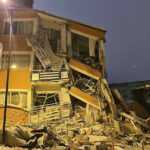 
              A collapsed building is seen following an earthquake in Pazarcik, in Kahramanmaras province, southern Turkey, early Monday, Feb. 6, 2023. A powerful earthquake has caused significant damage in southeast Turkey and Syria and many casualties are feared. Damage was reported across several Turkish provinces, and rescue teams were being sent from around the country.(Depo Photos via AP)
            