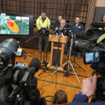 
              Ohio Governor Mike DeWine meets with reporters after touring the Norfolk and Southern train derailment site in East Palestine, Ohio, Monday, Feb. 6, 2023. Authorities in Ohio say they plan to release toxic chemicals from five cars of a derailed train in Ohio to reduce the threat of an explosion. (AP Photo/Gene J. Puskar)
            