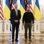 
              US President Joe Biden, left, poses with Ukrainian President Volodymyr Zelenskyy at Mariinsky Palace during an unannounced visit in Kyiv, Ukraine, Monday, Feb. 20, 2023. (AP Photo/Evan Vucci, Pool)
            