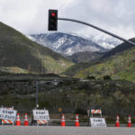 
              Road closure signs are placed along Highway 330 that leads to Big Bear and Lake Arrowhead in Highland, Calif., Tuesday, Feb. 28, 2023. Beleaguered Californians got hit again Tuesday as a new winter storm moved into the already drenched and snow-plastered state, with blizzard warnings blanketing the Sierra Nevada and forecasters warning residents that any travel was dangerous. (AP Photo/Jae C. Hong)
            