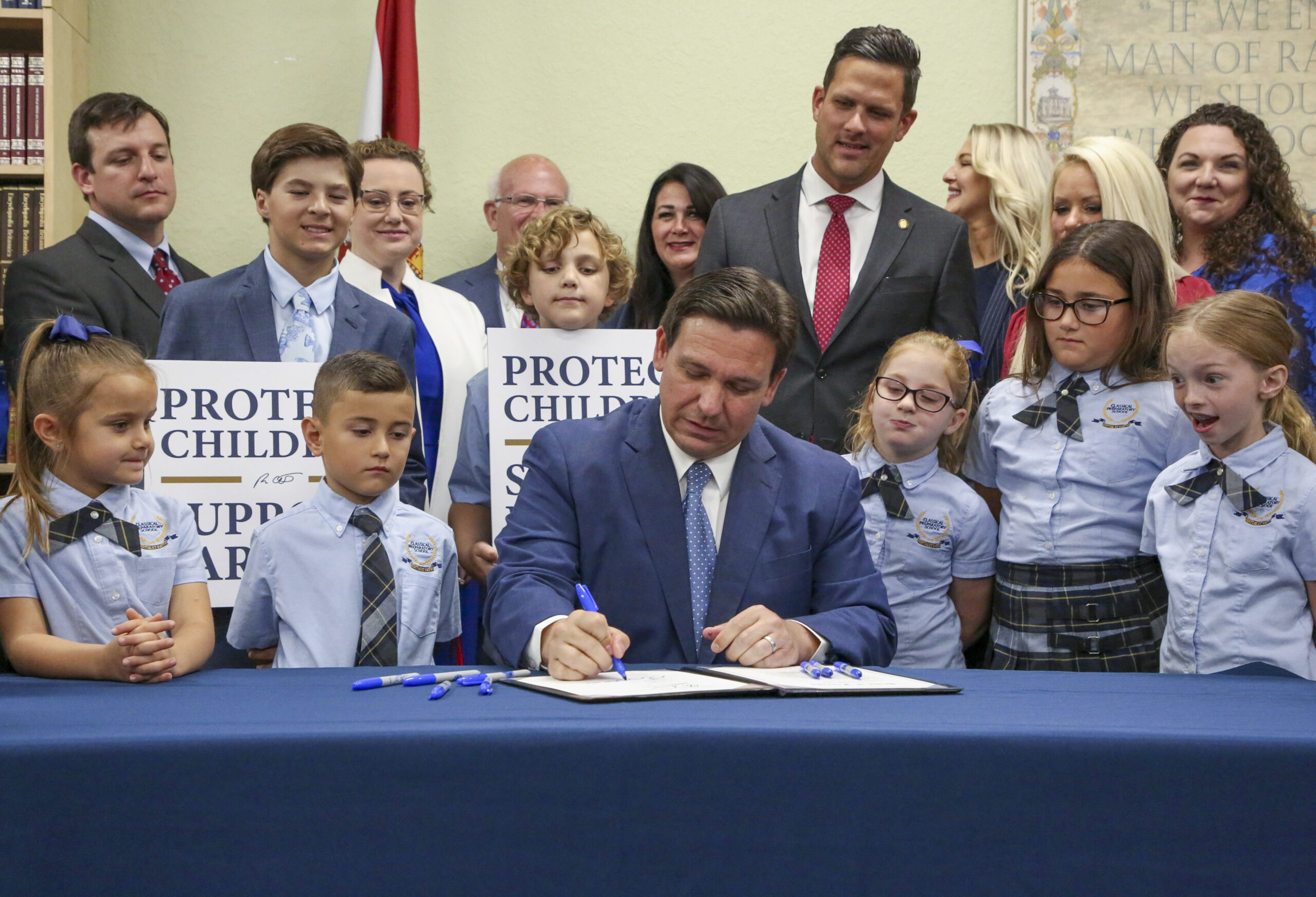 FILE - Florida Gov. Ron DeSantis signs the Parental Rights in Education bill at Classical Preparato...