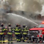 A fire engulfed a vacant building in Seattle's Lake City neighborhood Friday. (Sam Campbell/KIRO Newsradio)