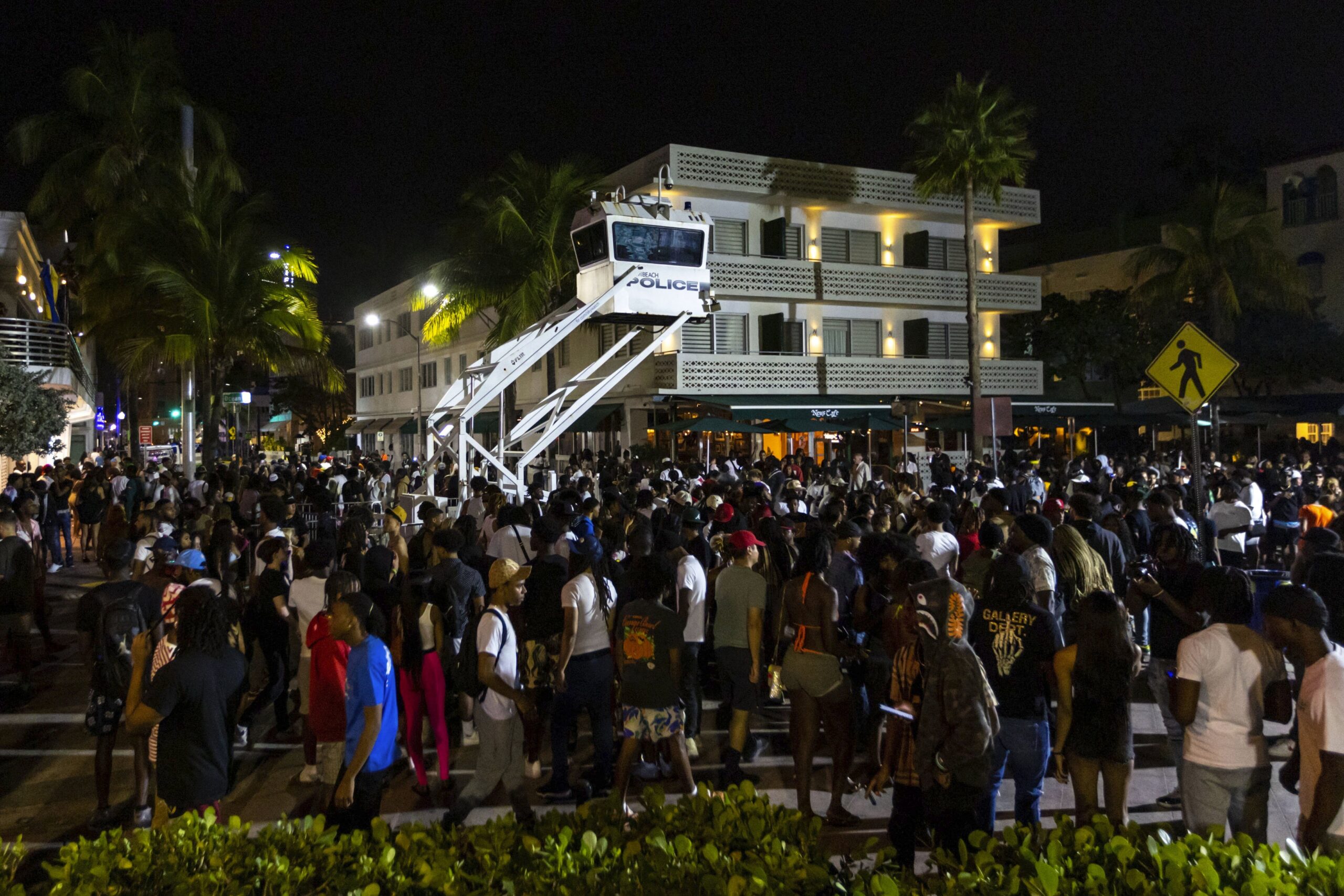 Crowds gather at Ocean Drive and 8th during spring break on Saturday, March 18, 2023, in Miami Beac...