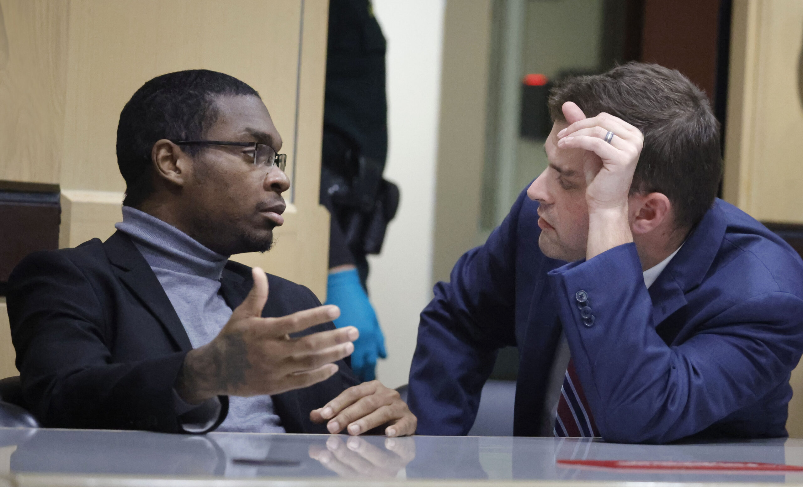 Shooting suspect Michael Boatwright talks to his attorney Joseph Kimok during day six of jury delib...